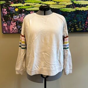 Off White Boden sweatshirt with colorful striped sleeves.